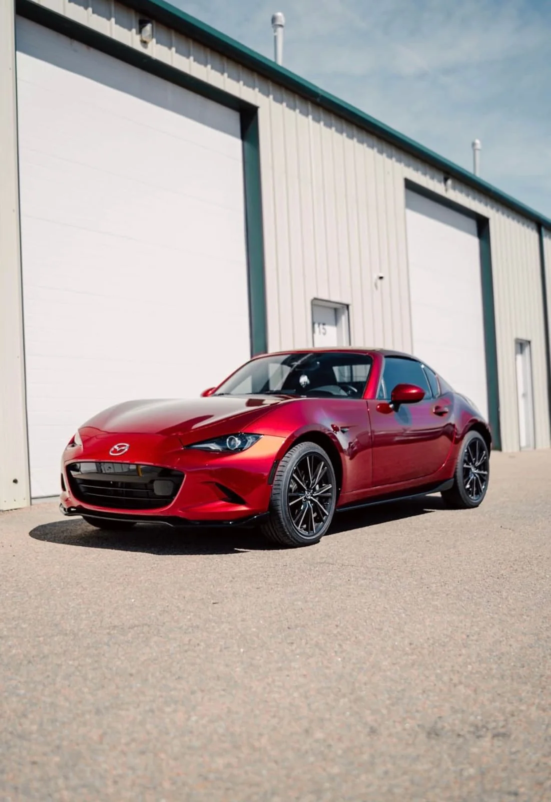 Red Mazda MX-5 outside the 719 Auto Customs shop